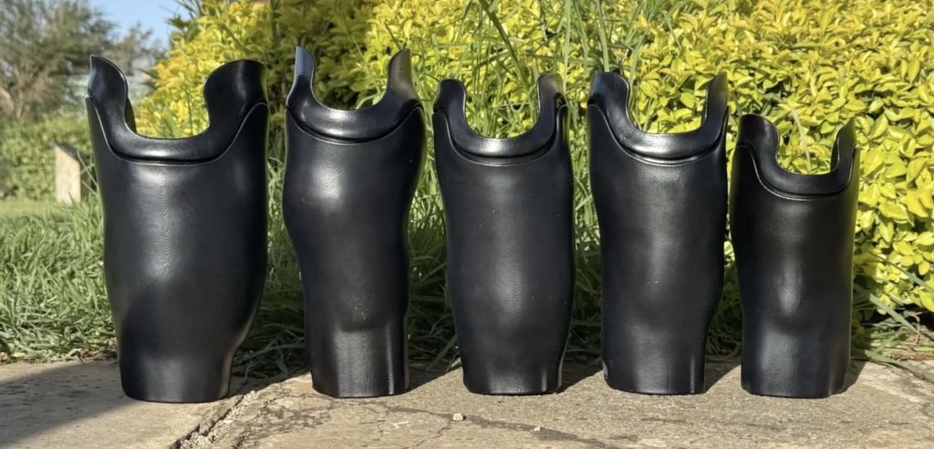 A photo of 5 prosthetics produced by ABCorp 3D printing to support Limb Kind Foundation's mission
