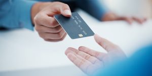 Photo of a credit union member receiving their instant issuance debit card