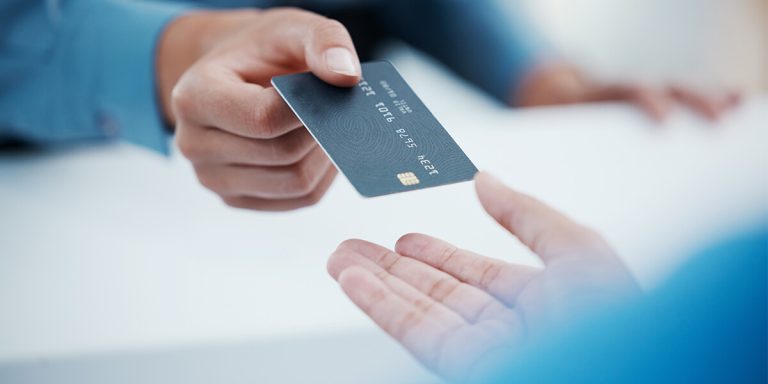 Photo of a credit union member receiving their instant issuance debit card